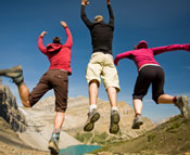 Young adults jumping in the air