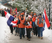 A group of people walking with flags