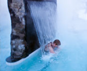 Woman under a waterfall