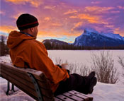 Man sitting on bench in the Canadian Rockies